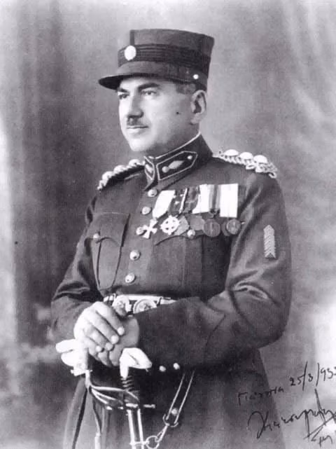 Portrait of an army officer in peaked cap and uniform with medals